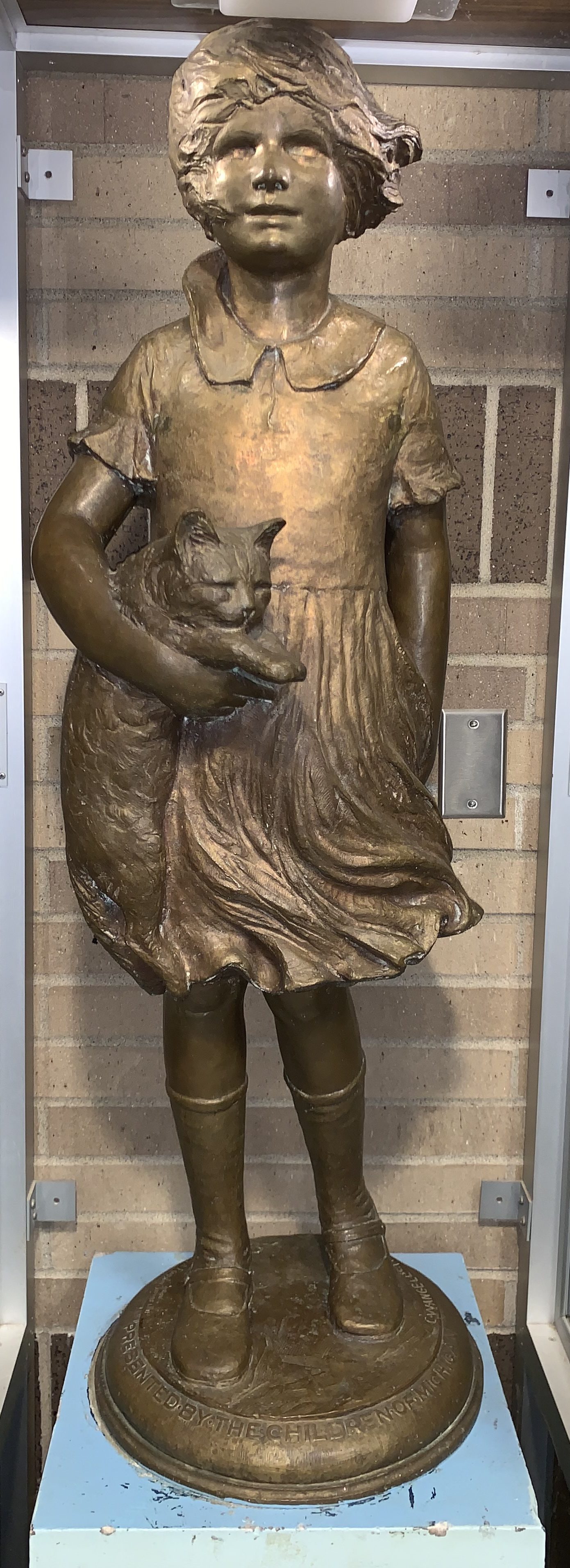 Girl with cat statue Bath School Museum